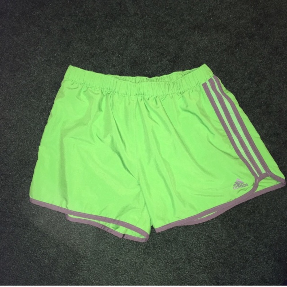 Green adidas running shorts